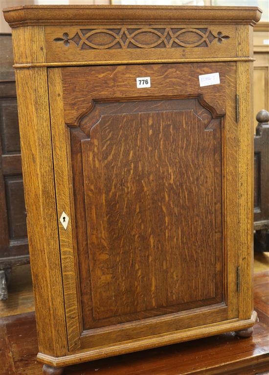 An oak corner cupboard, H.83cm